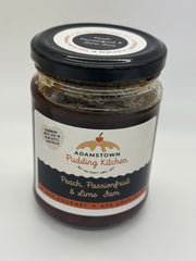 Jar of Adamstown Pudding Kitchen peach, passionfruit, and lime jam on a white background